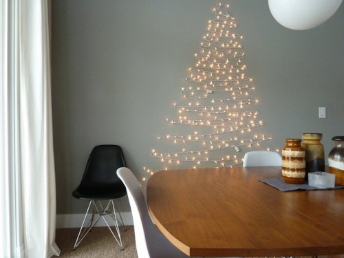 christmas tree made of lights on wall photo - 3